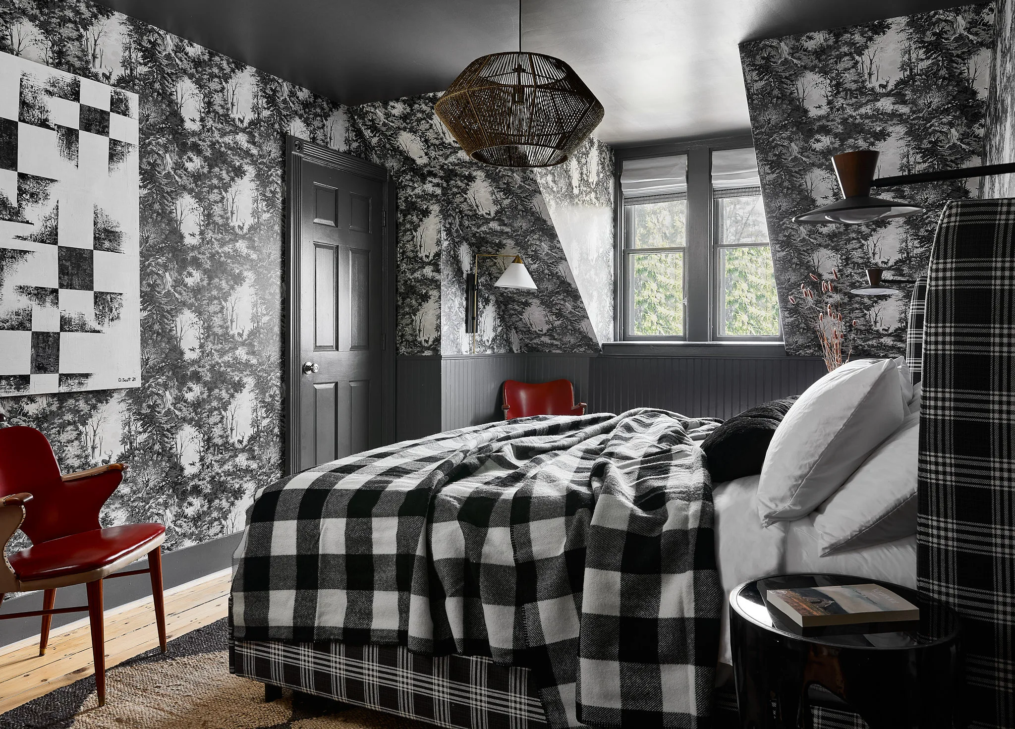 A guest room at Blind Tiger Burlington with a comfortable seating area.